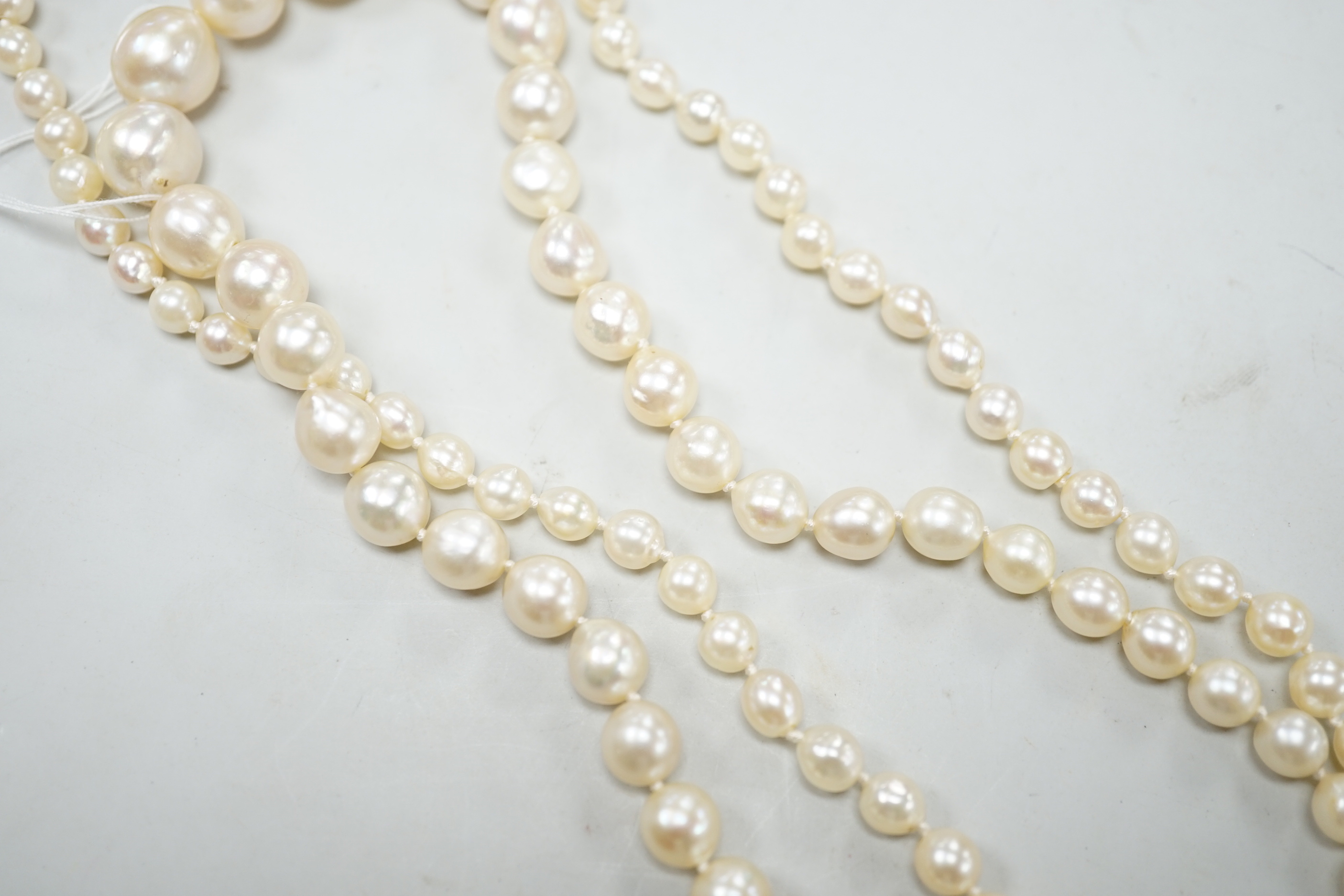A single strand graduated cultured pearl necklace, now with an earlier 19th century seed pearl and plaited hair set clasp, 76cm, together with original clasp.